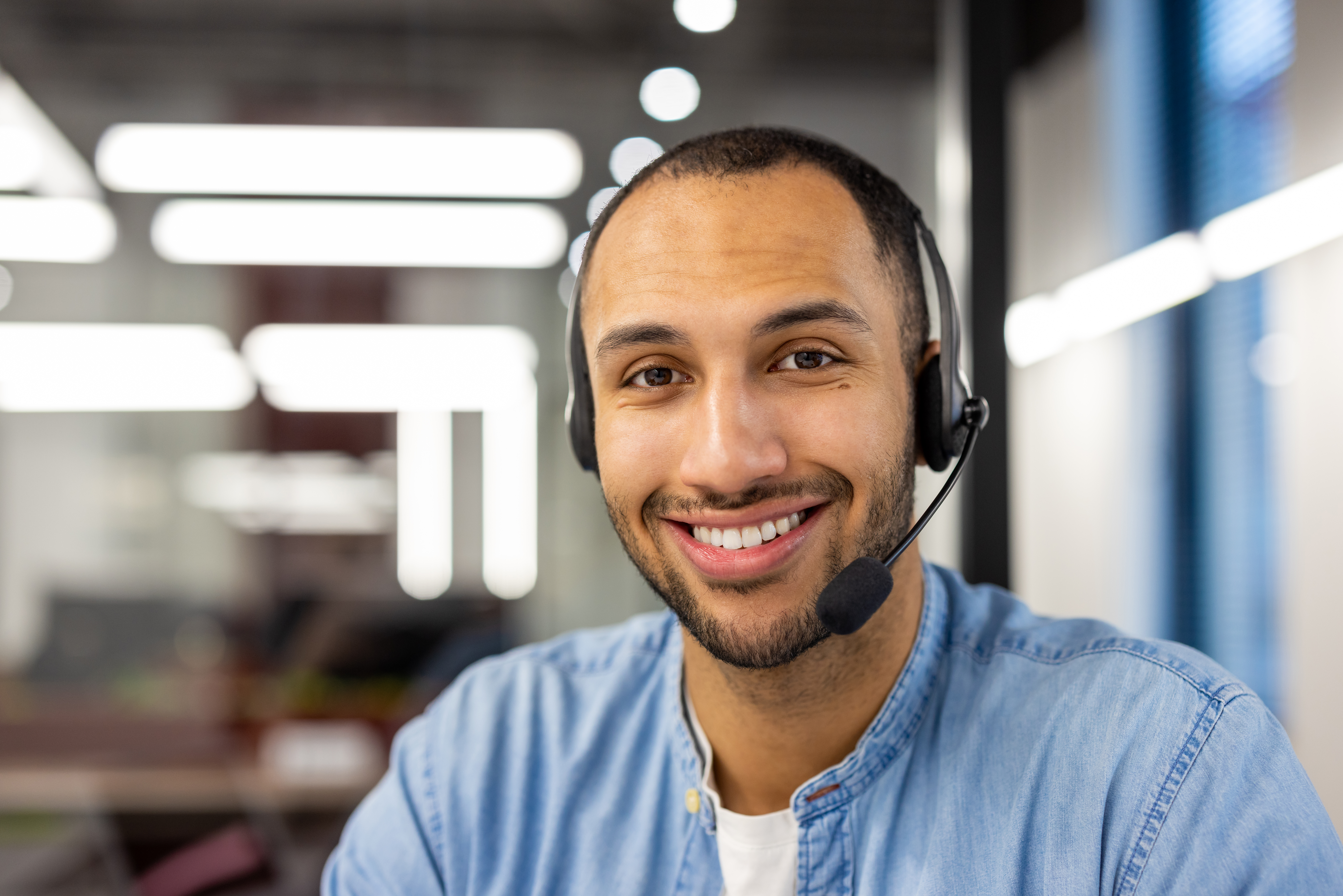 Male professional with headset in modern office Male professional with headset in modern office