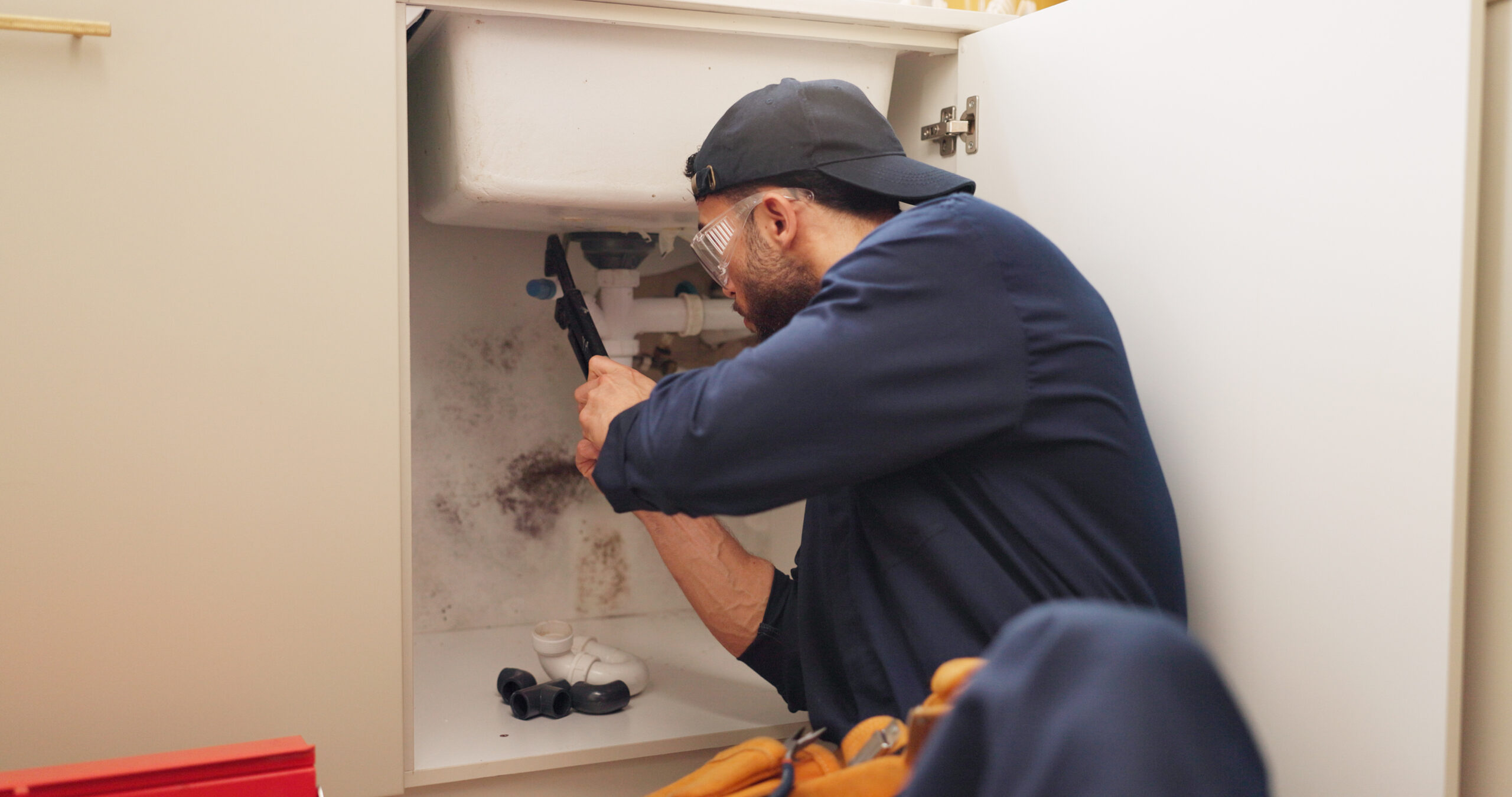 plumber man and tools for pipeline in kitchen wit 2025 04 06 08 53 19 utc plumber man and tools for pipeline in kitchen wit 2025 04 06 08 53 19 utc